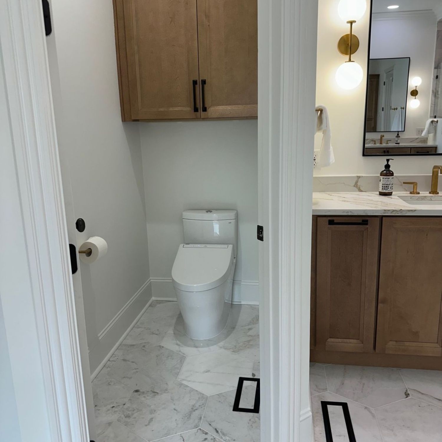 after bathroom remodel with new flooring and countertops